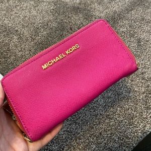 Hot pink Michael Kors wallet.